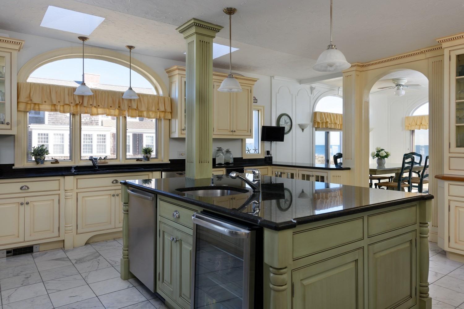 283 Long Beach Road Centerville, MA 02632 - Photo 19 of 30 a kitchen with a sink and a stove