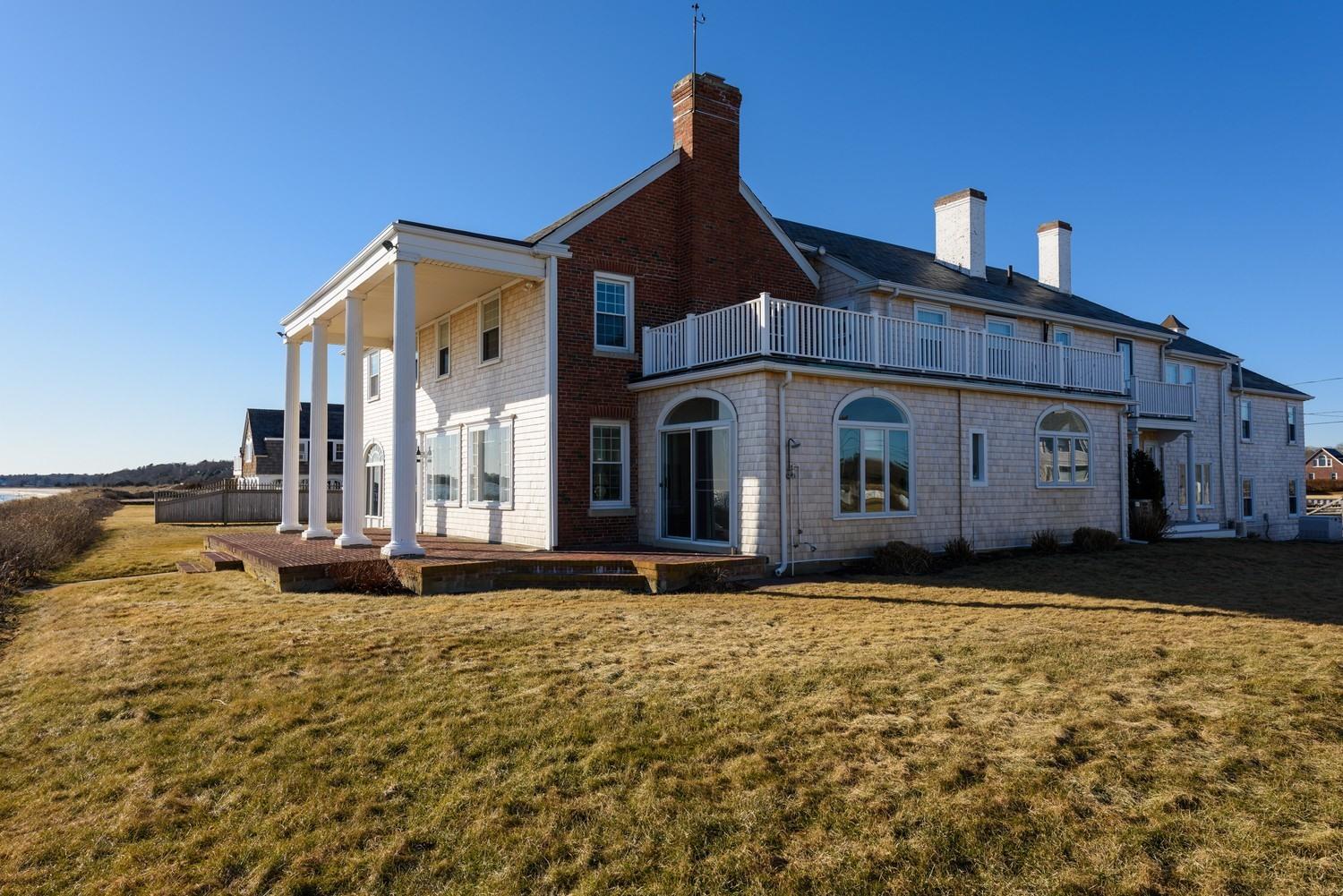283 Long Beach Road Centerville, MA 02632 - Photo 2 of 30 a front view of a house with a yard