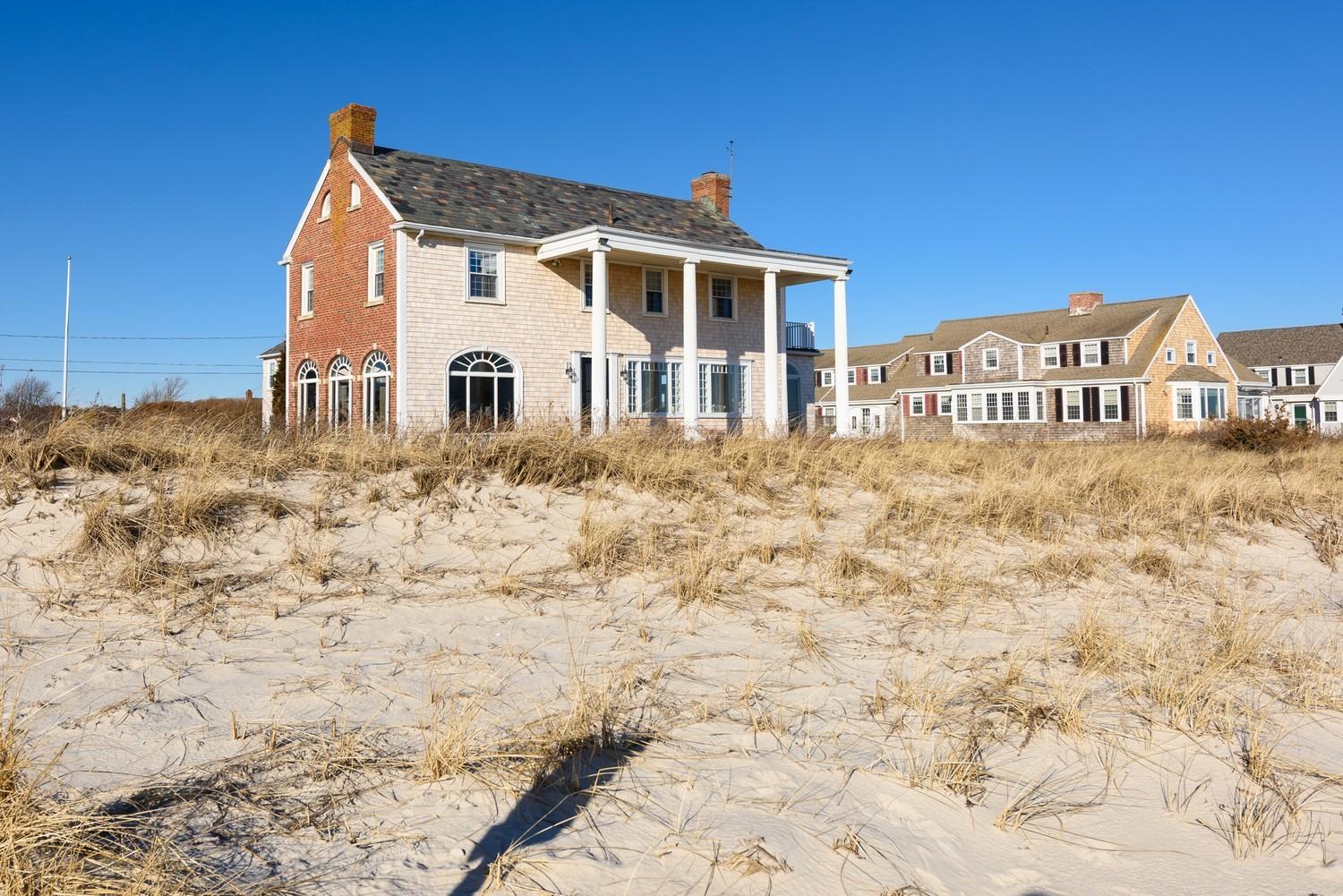 283 Long Beach Road Centerville, MA 02632 - Photo 9 of 30 a front view of a house with a yard