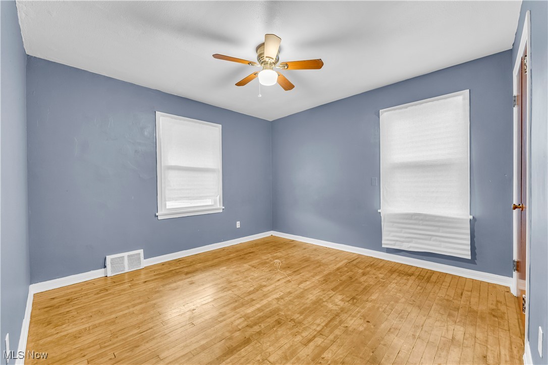 968 South Green Road Cleveland, OH 44121 - Photo 17 of 25 Spare room with ceiling fan and hardwood / wood-style flooring