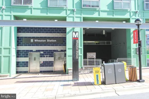 a view of a brick building with a door and a window