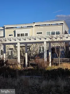 a view of a patio with a table and chairs