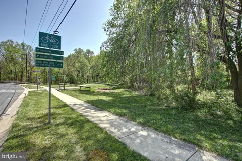 a sign board with a yard
