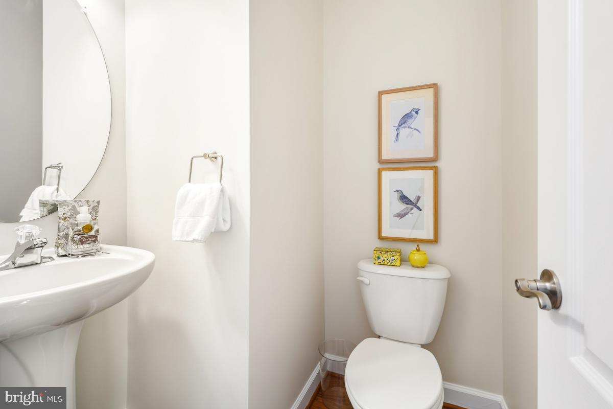 2207 Leesborough Drive Silver Spring, MD 20902 - Photo 7 of 44 a bathroom with a toilet sink and mirror