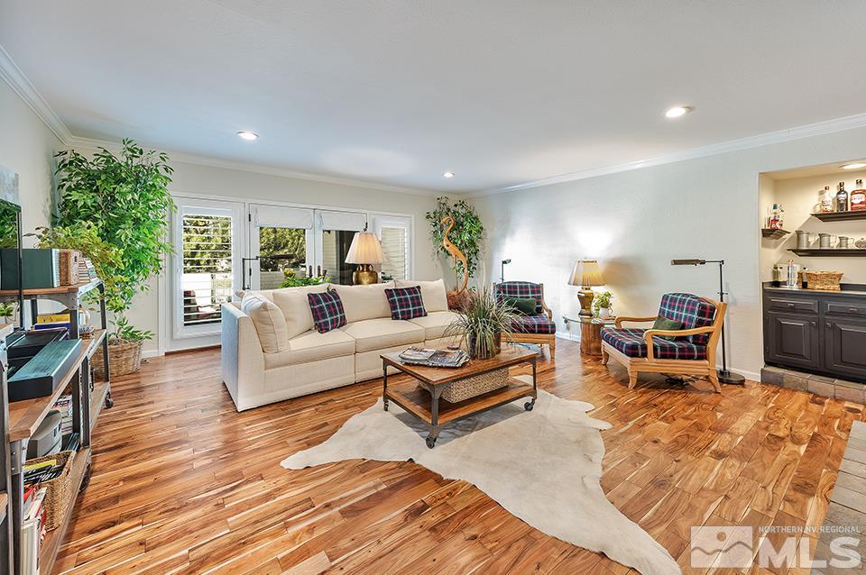 4945 West Lakeridge Terrace Reno, NV 89509 - Photo 11 of 25 a living room with furniture and a wooden floor