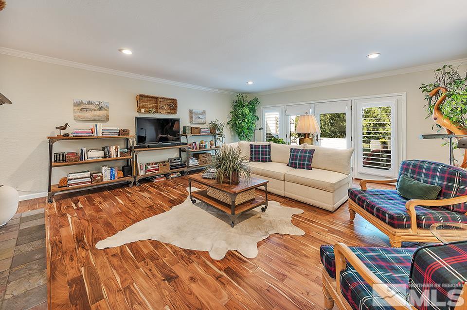 4945 West Lakeridge Terrace Reno, NV 89509 - Photo 12 of 25 a living room with furniture a rug and a flat screen tv