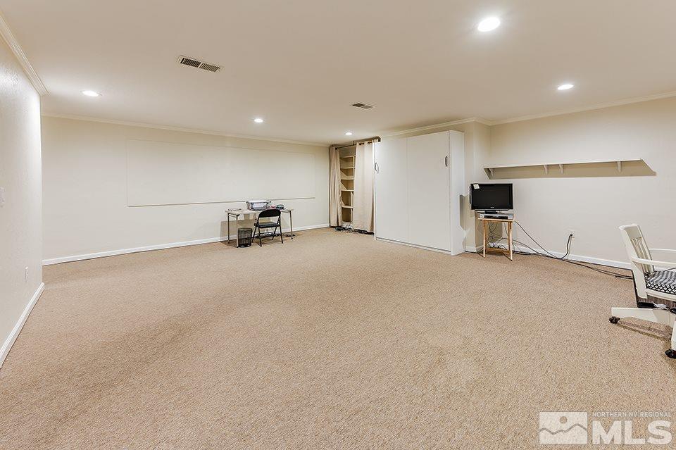 4945 West Lakeridge Terrace Reno, NV 89509 - Photo 15 of 25 an empty room with furniture and windows