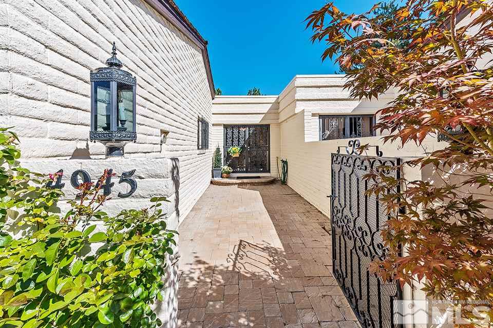 4945 West Lakeridge Terrace Reno, NV 89509 - Photo 2 of 25 a front view of a house with a garden