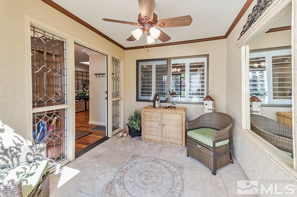 4945 West Lakeridge Terrace Reno, NV 89509 - Photo 3 of 25 a living room with furniture and a floor to ceiling window