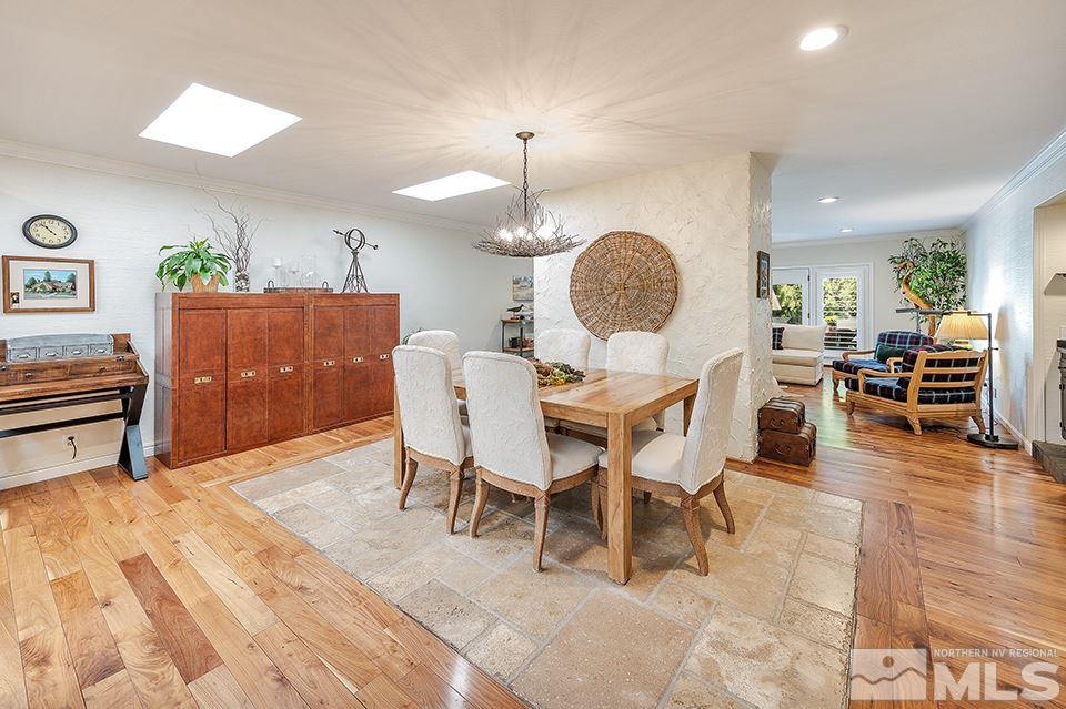 4945 West Lakeridge Terrace Reno, NV 89509 - Photo 5 of 25 a view of a dining room with furniture and wooden floor