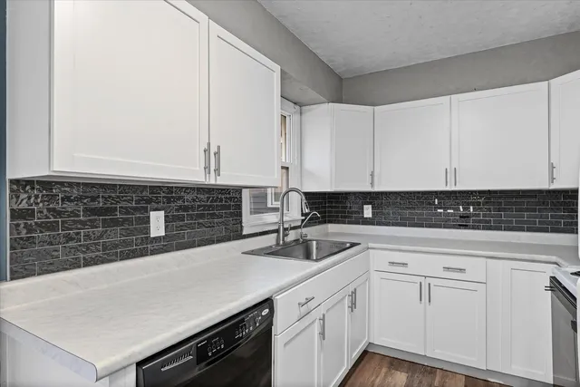 a white refrigerator freezer sitting inside of a kitchen