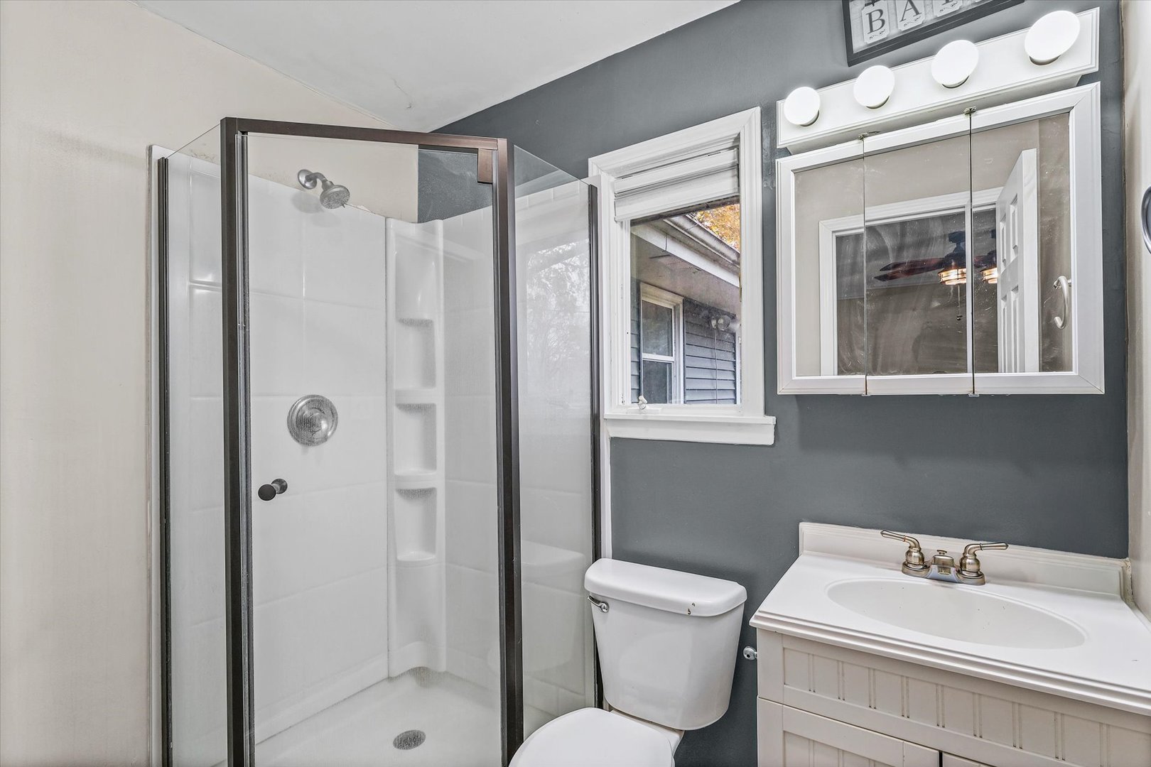 215 North 3rd Street Fisher, IL 61843 - Photo 21 of 32 a bathroom with a sink toilet and shower