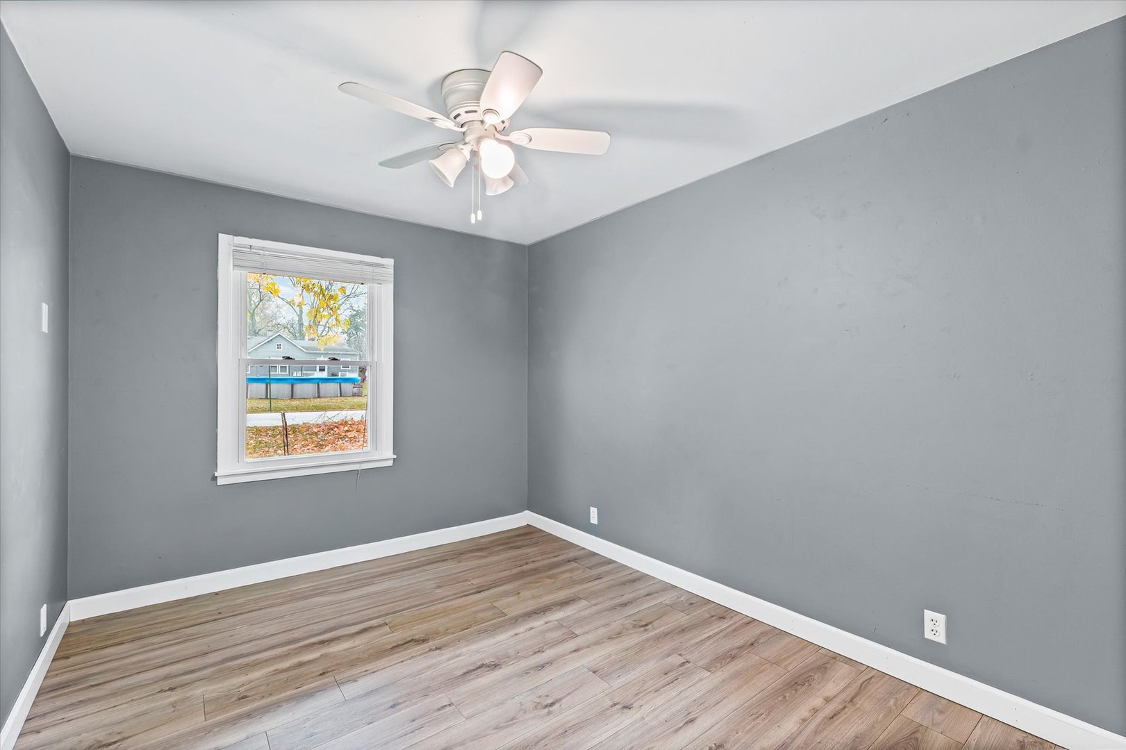 215 North 3rd Street Fisher, IL 61843 - Photo 26 of 32 wooden floor in an empty room with a window