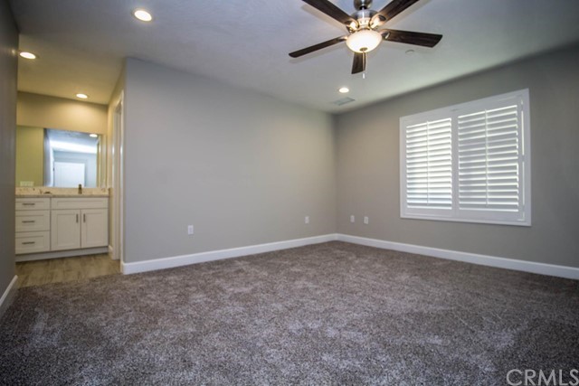 15648 Halinor Street Hesperia, CA 92345 - Photo 13 of 24 a view of an empty room with a window