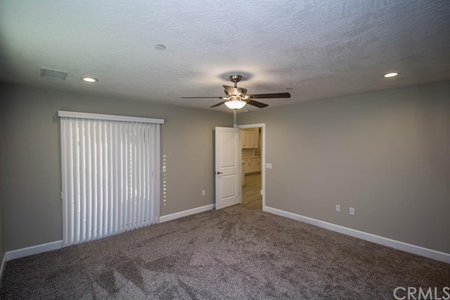 15648 Halinor Street Hesperia, CA 92345 - Photo 14 of 24 a view of a livingroom with a chandelier fan
