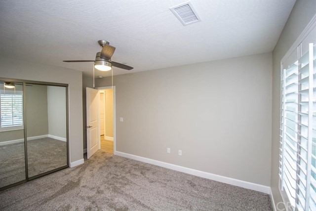 15648 Halinor Street Hesperia, CA 92345 - Photo 20 of 24 an empty room with fan and windows