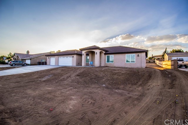 15648 Halinor Street Hesperia, CA 92345 - Photo 2 of 24 a big house with a big yard and large trees