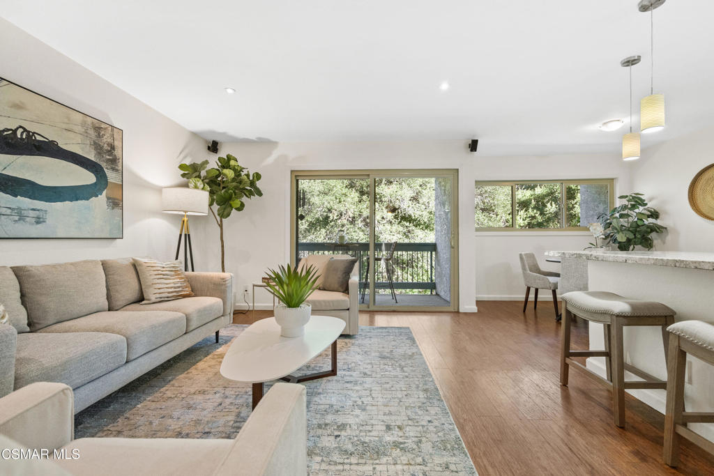 23637 Park Capri, Unit 36 Calabasas, CA 91302 - Photo 12 of 39 a living room with furniture and a large window