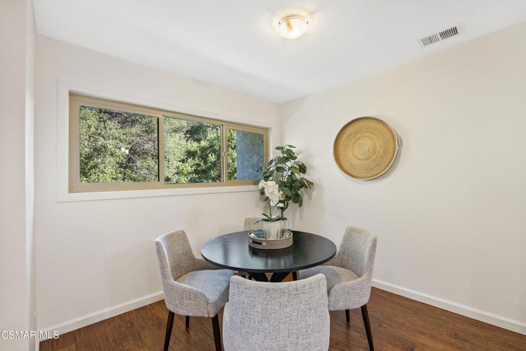 23637 Park Capri, Unit 36 Calabasas, CA 91302 - Photo 16 of 39 a dining room with furniture and wooden floor