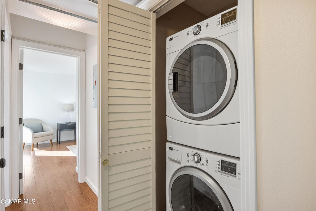 23637 Park Capri, Unit 36 Calabasas, CA 91302 - Photo 29 of 39 a view of a hallway with washer and dryer