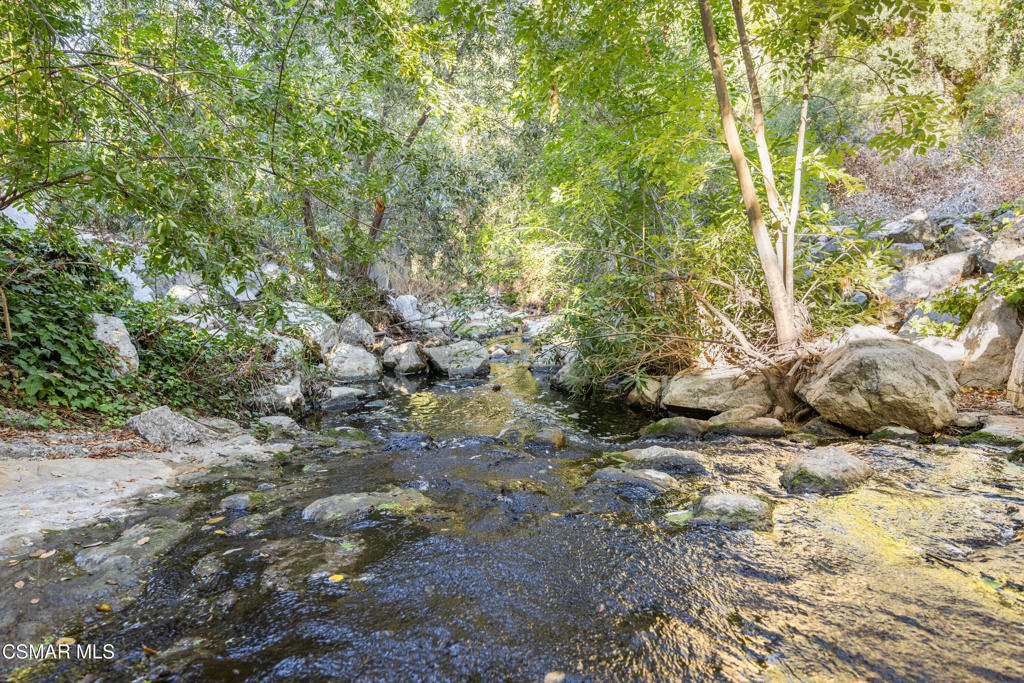 23637 Park Capri, Unit 36 Calabasas, CA 91302 - Photo 31 of 39 a view of an outdoor space with a lake view