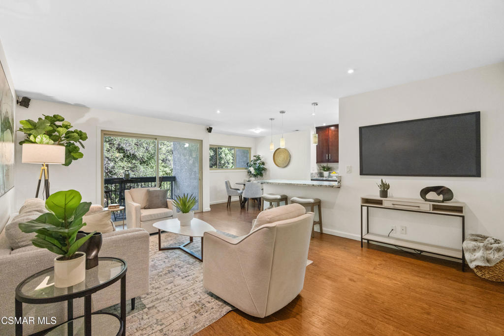 23637 Park Capri, Unit 36 Calabasas, CA 91302 - Photo 5 of 39 a living room with furniture and a flat screen tv