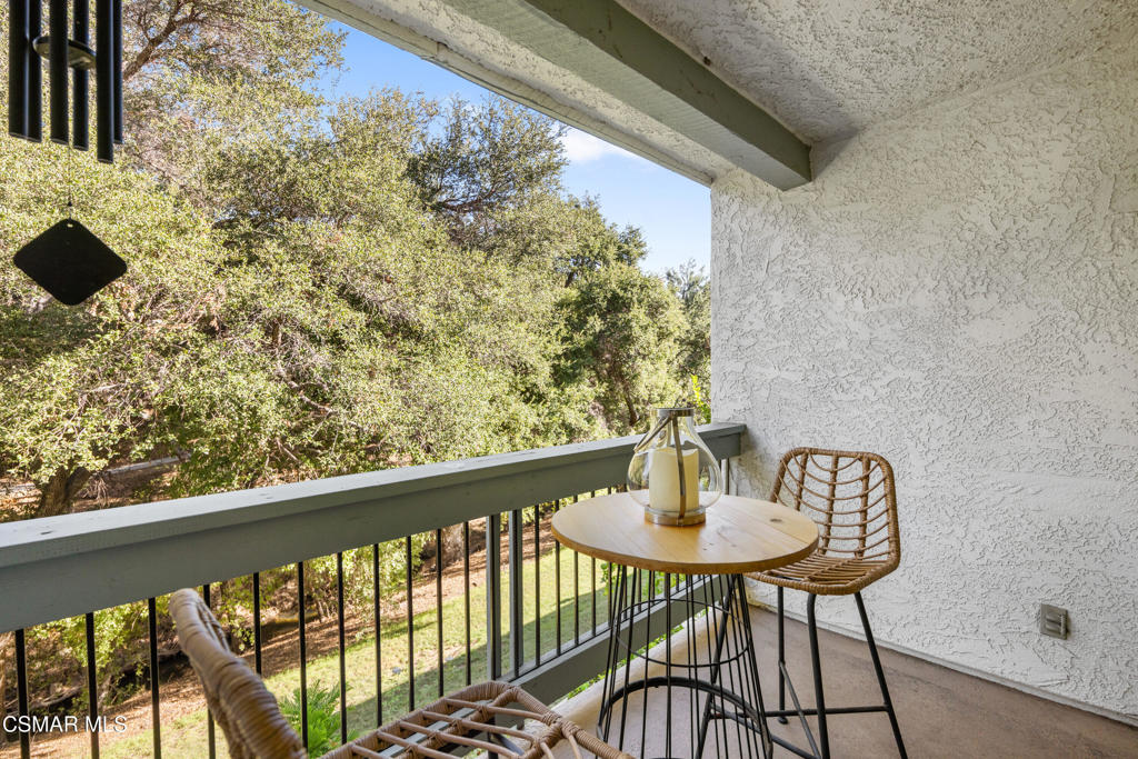 23637 Park Capri, Unit 36 Calabasas, CA 91302 - Photo 9 of 39 a balcony with table and chairs