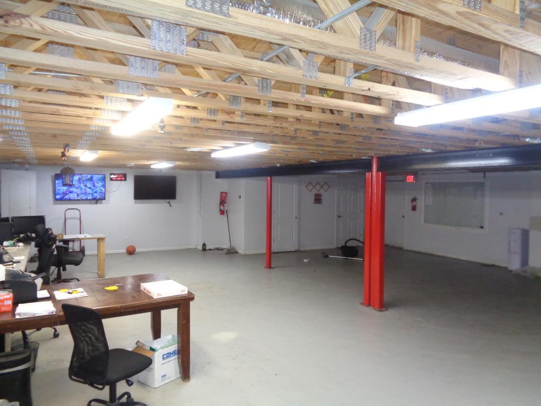 11629 South Green Street Chicago, IL 60628 - Photo 11 of 12 a view of a room with gym equipment