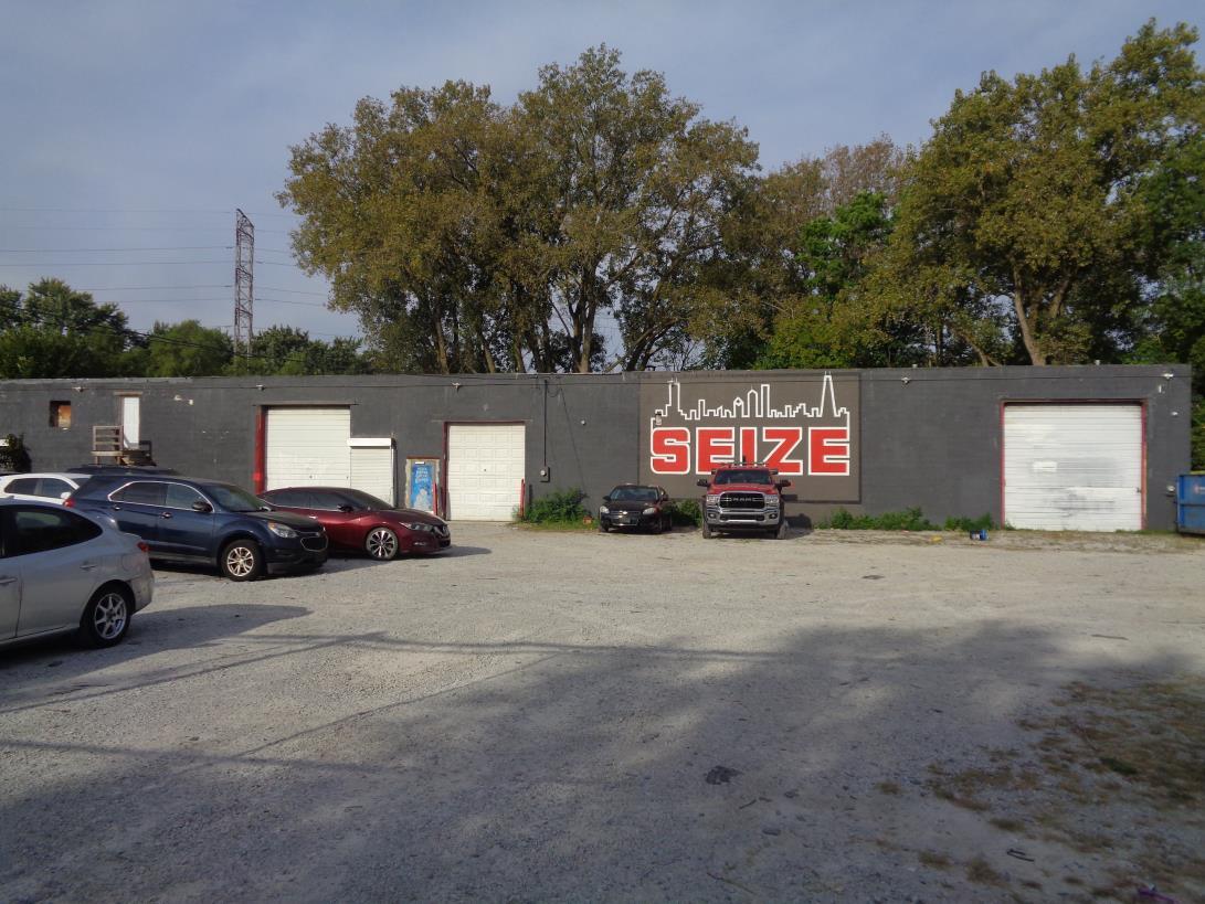 11629 South Green Street Chicago, IL 60628 - Photo 2 of 12 a view of street with parked cars