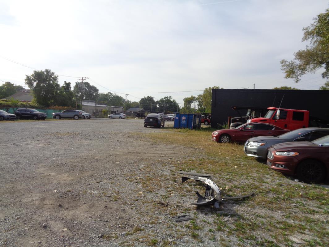 11629 South Green Street Chicago, IL 60628 - Photo 4 of 12 a backyard of a house with table and chairs