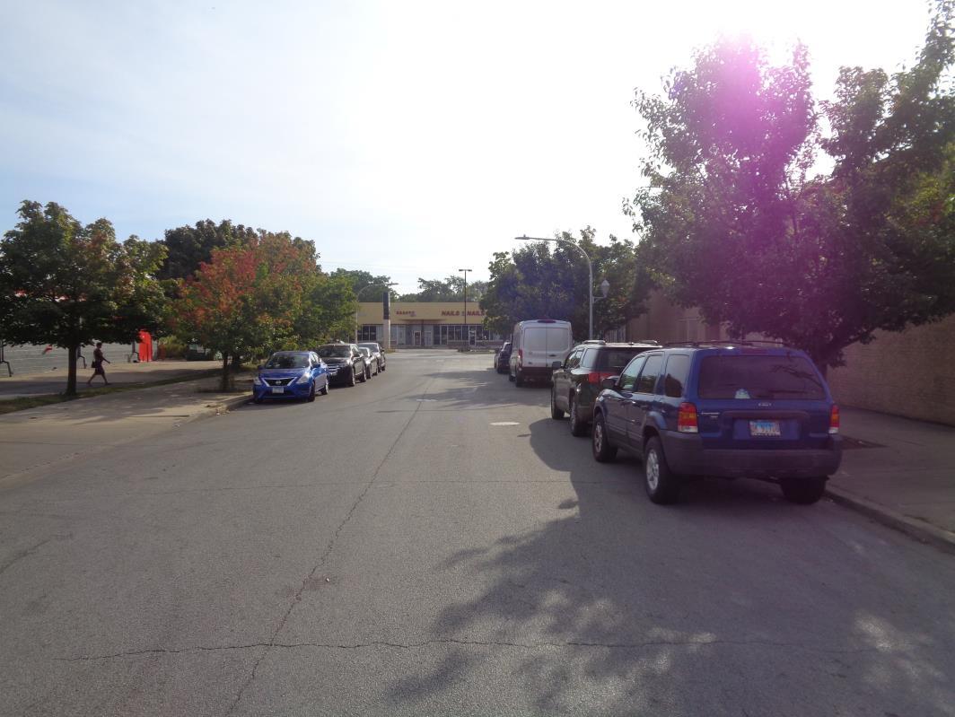 11629 South Green Street Chicago, IL 60628 - Photo 8 of 12 a view of street with parked cars