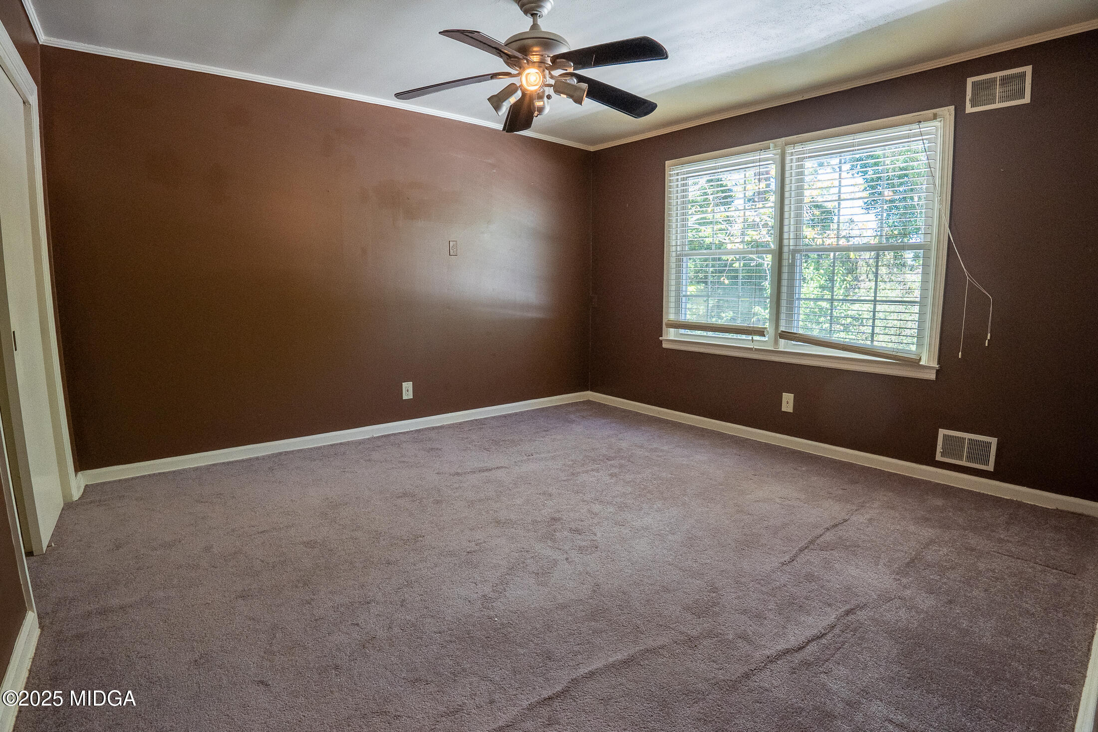 2939 General Lee Road Macon, GA 31204 - Photo 27 of 38 an empty room with windows and fan