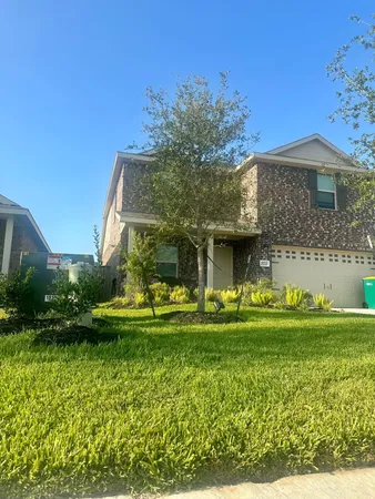 a view of a swimming pool with sitting area