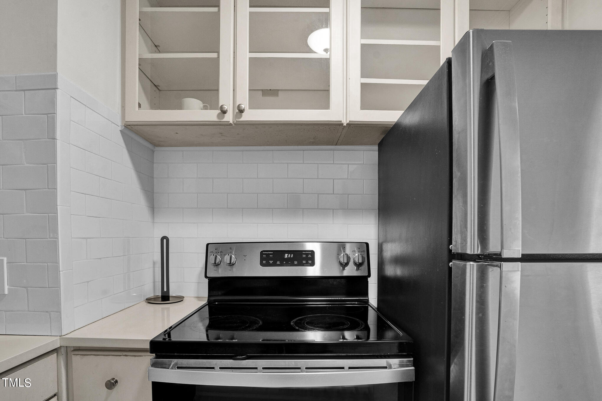 1941 Clark Avenue, Unit 101 Raleigh, NC 27605 - Photo 11 of 15 a stove top oven sitting inside of a kitchen