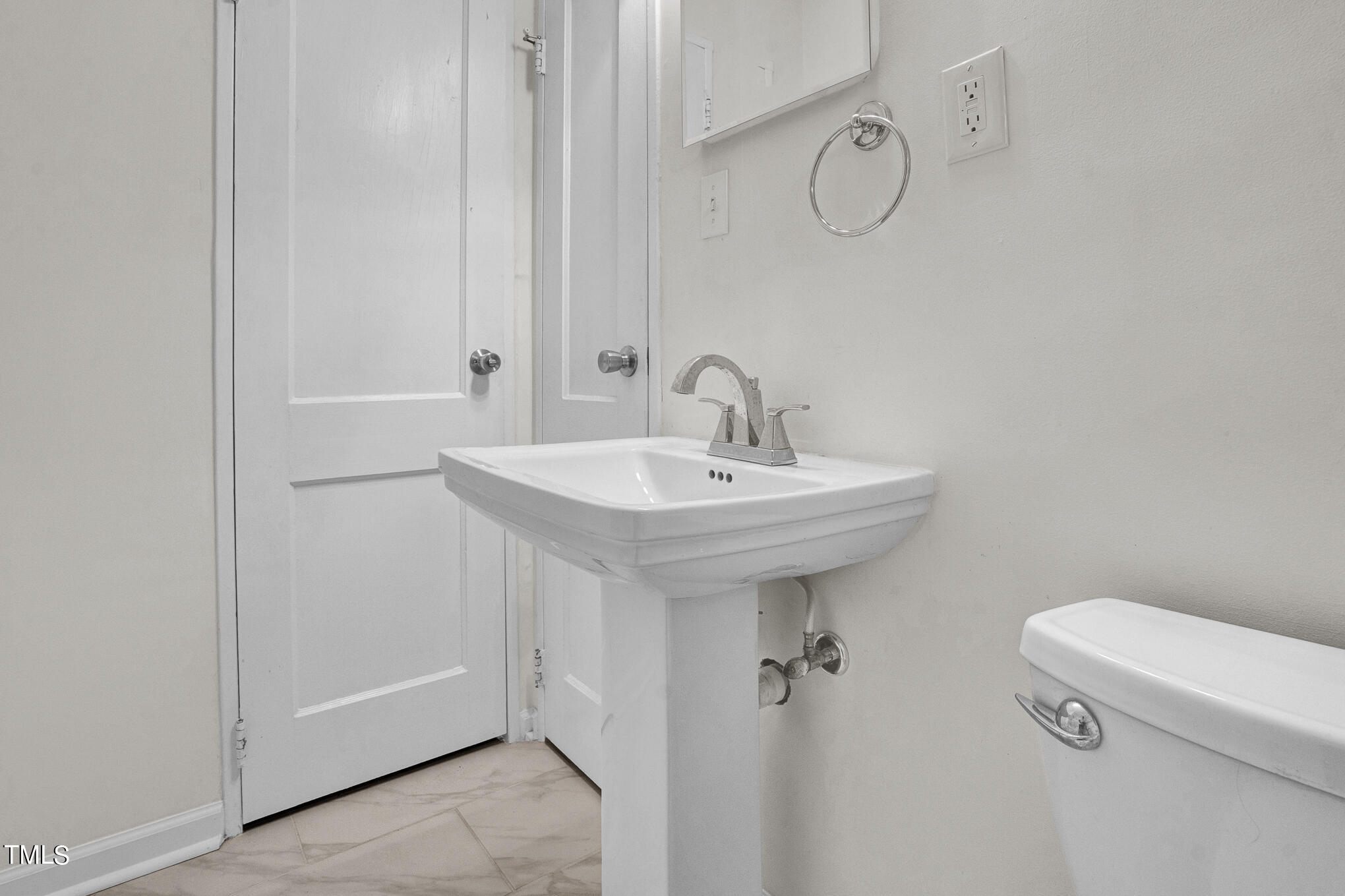 1941 Clark Avenue, Unit 101 Raleigh, NC 27605 - Photo 14 of 15 a bathroom with a sink a toilet and shower
