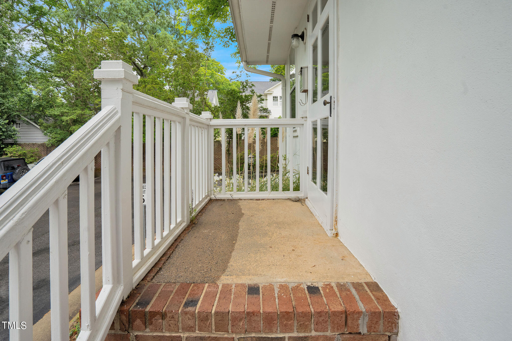 1941 Clark Avenue, Unit 101 Raleigh, NC 27605 - Photo 3 of 15 a view of a balcony with wooden floor