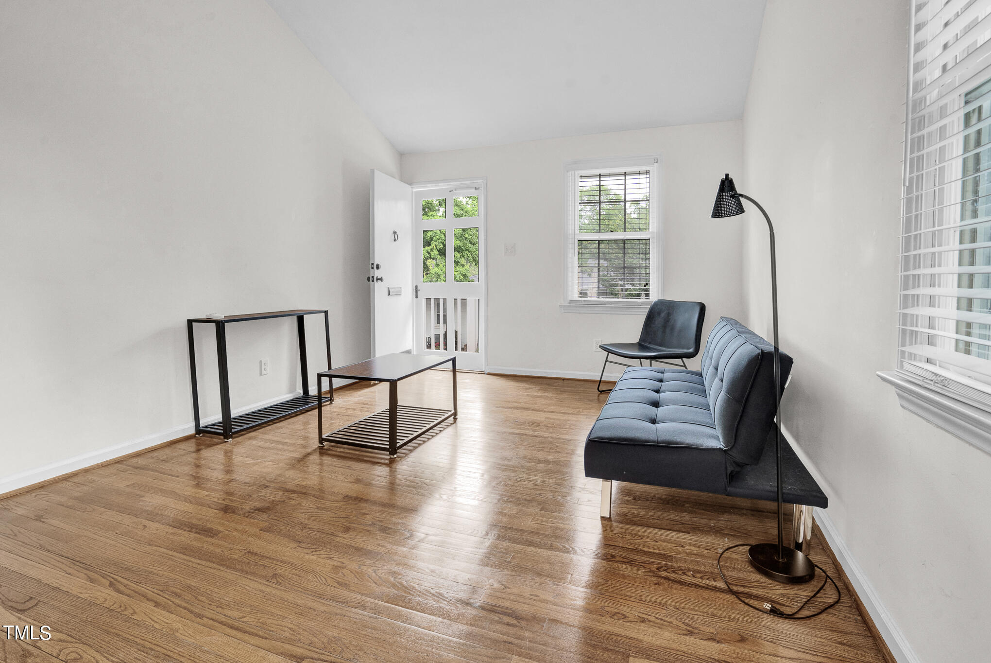 1941 Clark Avenue, Unit 101 Raleigh, NC 27605 - Photo 6 of 15 a living room with furniture and a wooden floor