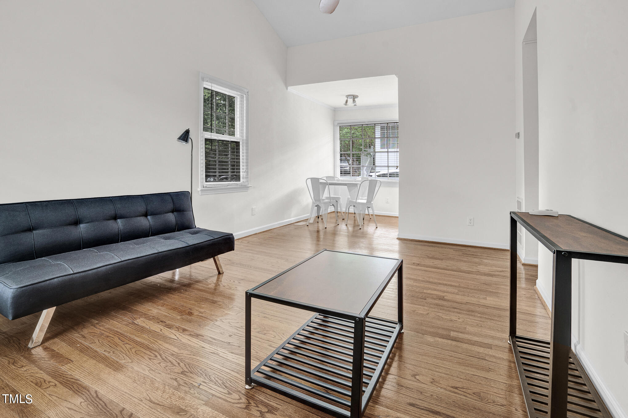 1941 Clark Avenue, Unit 101 Raleigh, NC 27605 - Photo 7 of 15 a living room with furniture and a wooden floor