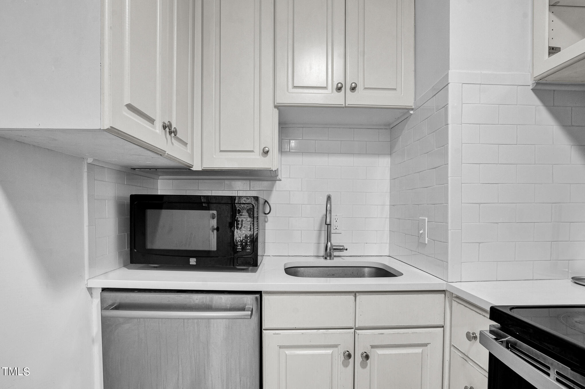 1941 Clark Avenue, Unit 101 Raleigh, NC 27605 - Photo 10 of 15 a kitchen with appliances a sink and cabinets