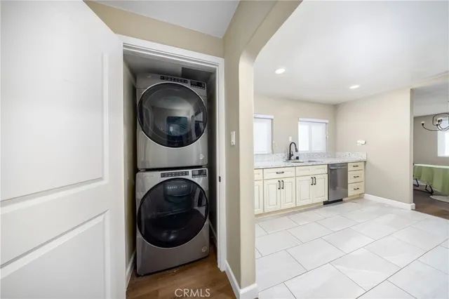a kitchen with a washer and dryer in it