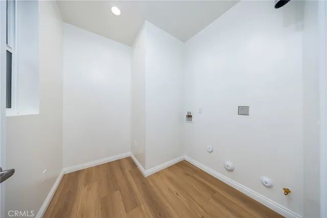 a view of room with wooden floor