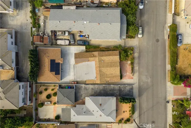 aerial view of a house with large trees
