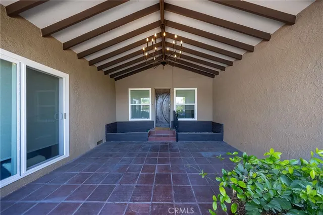 a view of entryway with flower pots