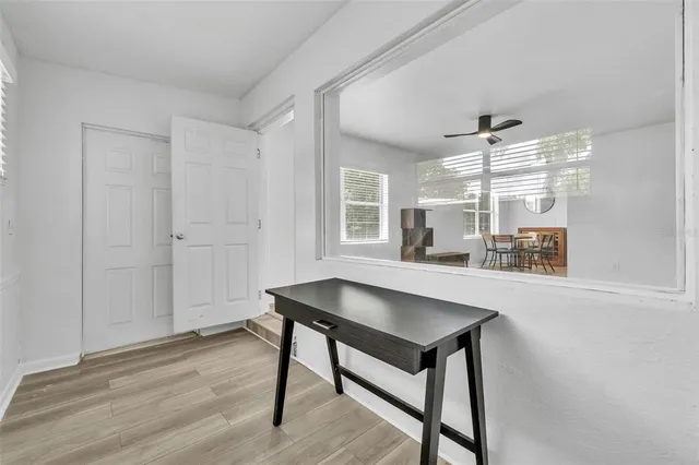 a workspace with furniture and window