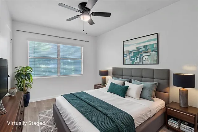 a bedroom with bed and a window