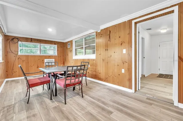 a dining room with furniture and window