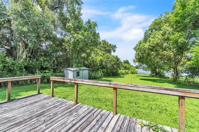 a view of a deck with a yard