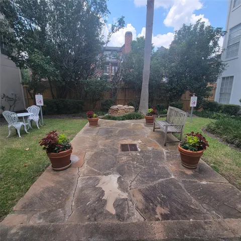 a view of a backyard with sitting area