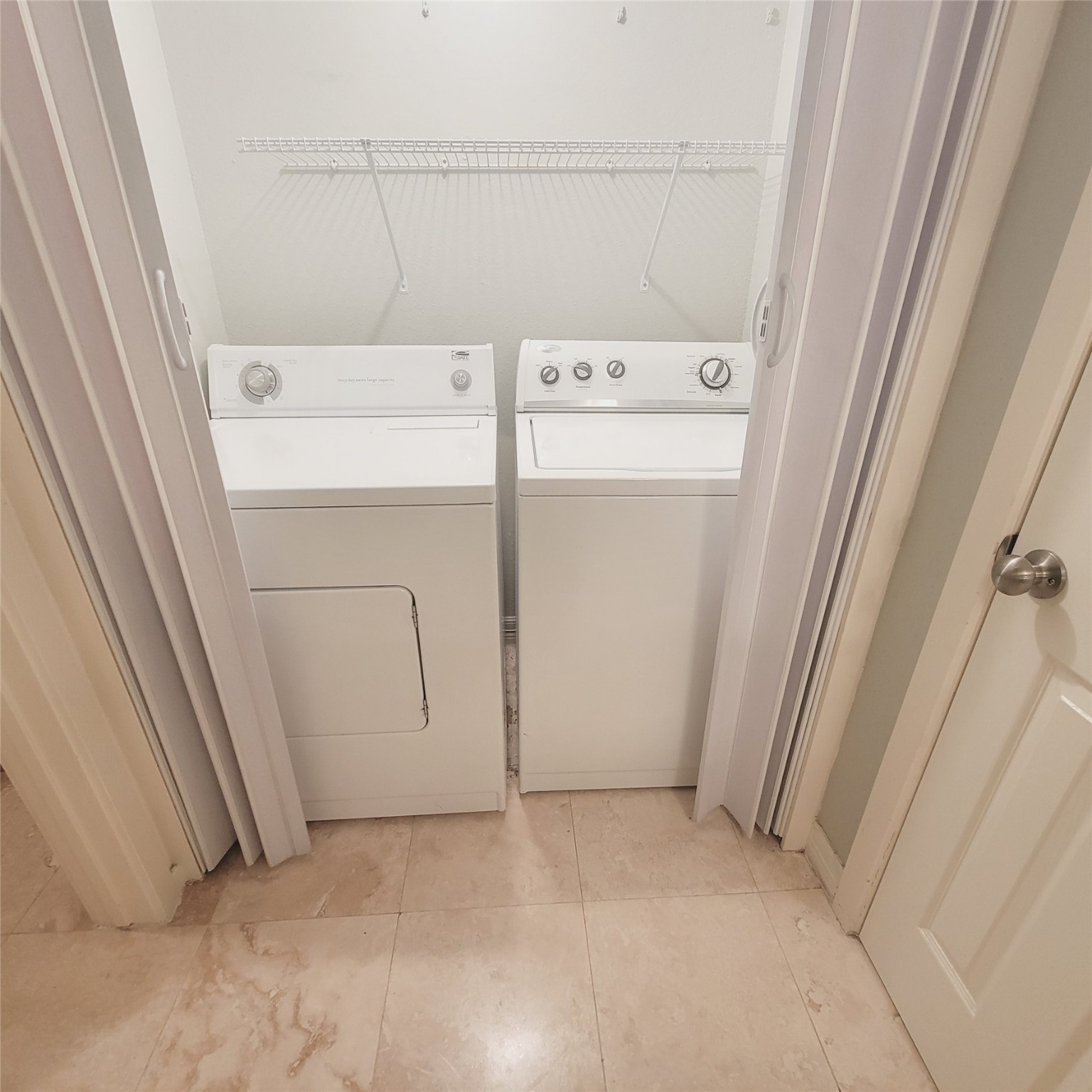 2333 Bering Drive, Unit 226 Houston, TX 77057 - Photo 23 of 33 a view of storage and utility room with washer and dryer