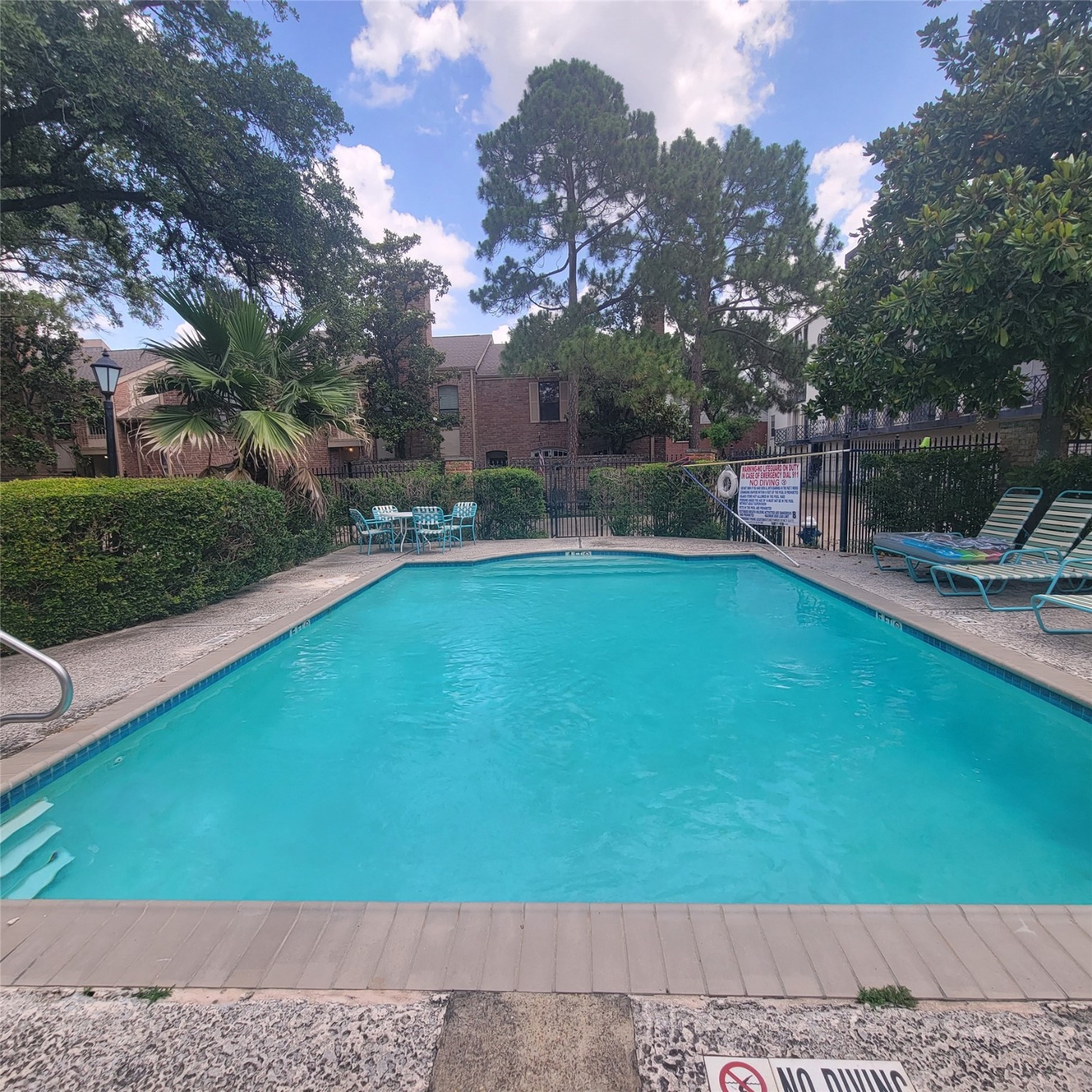 2333 Bering Drive, Unit 226 Houston, TX 77057 - Photo 29 of 33 a view of a swimming pool with a patio and a yard